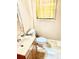 Modest bathroom with a single sink vanity, toilet, and a large window at 1111 S Skyland Dr, Mount Pleasant, NC 28124