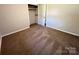 Bedroom featuring plush carpeting, neutral walls and closet perfect for storage at 1111 S Skyland Dr, Mount Pleasant, NC 28124