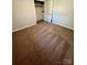 Bedroom featuring plush carpeting, neutral walls and closet perfect for storage at 1111 S Skyland Dr, Mount Pleasant, NC 28124