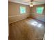 Bedroom with neutral walls and plush carpeting, illuminated by natural light from two windows at 1111 S Skyland Dr, Mount Pleasant, NC 28124