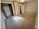 Bedroom featuring natural light, neutral walls, carpeting, and closet for optimal comfort and storage at 1111 S Skyland Dr, Mount Pleasant, NC 28124