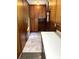 Spacious kitchen with ample wooden cabinetry, white countertops, and a combination of stylish flooring textures at 1111 S Skyland Dr, Mount Pleasant, NC 28124