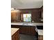 Traditional kitchen with wood cabinets, white countertops, and stainless steel appliances, offering a functional and classic design at 1111 S Skyland Dr, Mount Pleasant, NC 28124
