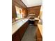 Bright kitchen with stainless steel appliances, wood cabinets, and natural light creating a warm and inviting space at 1111 S Skyland Dr, Mount Pleasant, NC 28124