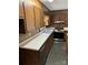 Traditional kitchen featuring wood cabinets, sleek countertops, and stainless steel appliances for a blend of classic and modern appeal at 1111 S Skyland Dr, Mount Pleasant, NC 28124