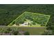 Aerial view of property showcasing lush landscaping and mature trees on a spacious lot at 12770 Bringle Ferry Rd, Richfield, NC 28137