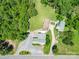 This aerial view shows multiple buildings surrounded by lush landscaping and mature trees at 12770 Bringle Ferry Rd, Richfield, NC 28137