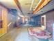 Rustic finished basement features wood paneling and exposed beams at 12770 Bringle Ferry Rd, Richfield, NC 28137