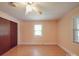 This cozy bedroom features gleaming hardwood floors and large windows that let in plenty of light at 12770 Bringle Ferry Rd, Richfield, NC 28137