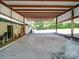 Open carport area with concrete flooring for parking or storage at 12770 Bringle Ferry Rd, Richfield, NC 28137