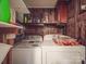 Cozy laundry room with washer, dryer and ample storage shelves for laundry essentials at 12770 Bringle Ferry Rd, Richfield, NC 28137