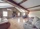 Large living room featuring hardwood floors, a fireplace, wood paneled walls, and lots of natural light at 12770 Bringle Ferry Rd, Richfield, NC 28137