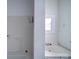 Simple bathroom with a sink, shower, and small window at 705 Neil St, Gastonia, NC 28052