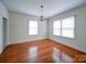 Formal dining room with hardwood floors and a chandelier at 705 Neil St, Gastonia, NC 28052