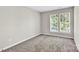 An empty bedroom with carpet and a window with blinds at 20528 Harbor View Dr, Cornelius, NC 28031