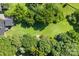 Aerial view showcasing a home with an expansive lawn, mature trees, and a serene setting at 640 Davie Ave, Statesville, NC 28677