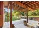 This back porch provides shade with string lights and leads to a spacious backyard at 640 Davie Ave, Statesville, NC 28677
