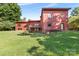 Expansive backyard featuring a deck, lush green lawn, and mature trees, perfect for outdoor living at 640 Davie Ave, Statesville, NC 28677