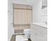 This bathroom has a combined shower/tub and toilet with a white vanity and neutral color scheme at 640 Davie Ave, Statesville, NC 28677