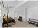 This bedroom is staged with a fireplace, plants, a black bed, and an interesting light at 640 Davie Ave, Statesville, NC 28677