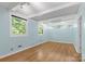 Spacious bedroom with hardwood floors and natural light at 640 Davie Ave, Statesville, NC 28677
