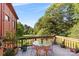 Relaxing outdoor deck with colorful seating overlooking a lush, green yard at 640 Davie Ave, Statesville, NC 28677