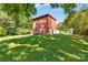 The home boasts a well-maintained lawn and lush greenery, offering curb appeal and tranquility at 640 Davie Ave, Statesville, NC 28677