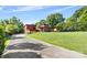 Stunning modern home with brick and siding, surrounded by lush greenery and a well-manicured lawn at 640 Davie Ave, Statesville, NC 28677