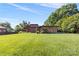 Beautiful home surrounded by a lush green lawn and mature trees offering a serene and inviting ambiance at 640 Davie Ave, Statesville, NC 28677