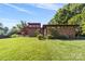 Picture-perfect home with a large manicured lawn and mature landscaping providing a welcoming exterior at 640 Davie Ave, Statesville, NC 28677