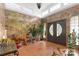 Grand foyer with stone walls, tile floors, clerestory windows, and double entry doors at 640 Davie Ave, Statesville, NC 28677