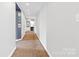 Hallway with carpeted floor leading to the kitchen and bedroom at 640 Davie Ave, Statesville, NC 28677