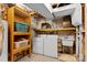 This laundry room includes a utility sink, a washer and dryer, and storage shelves at 640 Davie Ave, Statesville, NC 28677