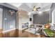 Cozy living room with hardwood floors, stone fireplace, coffered ceilings, and custom built-ins at 640 Davie Ave, Statesville, NC 28677