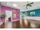 Open living room with hardwood floors, built-in shelves, and large windows at 640 Davie Ave, Statesville, NC 28677