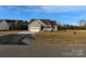 Newly constructed home with gray siding, white garage door, and front porch at 126 Mason Tanner Ct # 6, Rock Hill, SC 29730