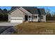 Gray siding house with white garage door and small front porch at 126 Mason Tanner Ct # 6, Rock Hill, SC 29730