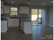 Modern kitchen with white cabinets, granite countertops, and island at 126 Mason Tanner Ct # 6, Rock Hill, SC 29730