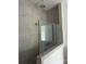 Modern bathroom with glass enclosed shower and neutral tile at 5209 Mint Harbor Way # 0352, Charlotte, NC 28269