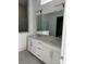 Bright bathroom featuring double sinks, a large mirror, and modern fixtures at 5209 Mint Harbor Way # 0352, Charlotte, NC 28269