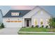 Charming home with a well-manicured lawn, attached garage, and inviting entrance at 5209 Mint Harbor Way # 0352, Charlotte, NC 28269