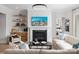 Comfortable living room featuring a fireplace, built-in shelving, and stylish decor at 5209 Mint Harbor Way # 0352, Charlotte, NC 28269