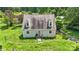House with gray siding and brown roof, surrounded by lush greenery at 7507 Waxhaw Creek Rd, Waxhaw, NC 28173
