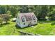 House with gray siding and brown roof, surrounded by trees at 7507 Waxhaw Creek Rd, Waxhaw, NC 28173