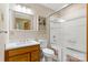 Clean bathroom with a tub/shower combo, vanity, and tiled walls at 7507 Waxhaw Creek Rd, Waxhaw, NC 28173