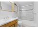 Clean bathroom with shower/tub combo and wood vanity at 7507 Waxhaw Creek Rd, Waxhaw, NC 28173