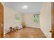 Simple bedroom with hardwood floors, two windows, and ample natural light at 7507 Waxhaw Creek Rd, Waxhaw, NC 28173
