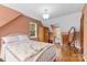 Bedroom with hardwood floors, wooden armoire and mirror at 7507 Waxhaw Creek Rd, Waxhaw, NC 28173