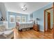 Light and airy bedroom with hardwood floors and ample closet space at 7507 Waxhaw Creek Rd, Waxhaw, NC 28173