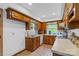 Galley kitchen with wood cabinets, tile floor, and ample counter space at 7507 Waxhaw Creek Rd, Waxhaw, NC 28173